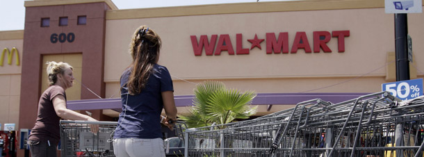 Wal-Mart shoppers use carts at a Wal-Mart store in Moutain View, California. A pay discrimination case against Wal-Mart begins today that involves by some estimates as many as 1.5 million women. (AP/Paul Sakuma)