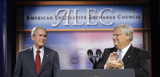 President George W. Bush, left, is introduced by Rep. Kenny Marchant (R-TX), right, prior to speaking at the American Legislative Exchange Council in 2007. A history professor was recently targeted by Republicans in Wisconsin for focusing on ALEC's role in drafting model laws that are then introduced by Republicans in state legislatures. (AP/Pablo Martinez Monsivais)
