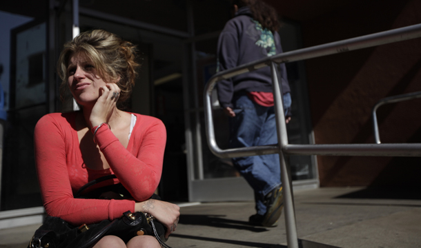 A woman waits to be called for an appointment for food stamps in El Cajon, California. The federal government’s Supplemental Nutrition Assistance Program, or SNAP, kept 3.6 million people out of poverty in 2009. (AP/Gregory Bull)