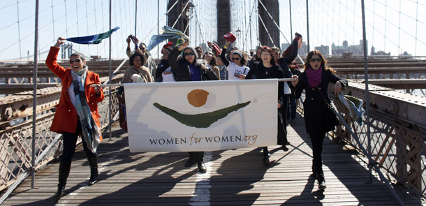 Women march across the Brooklyn Bridge in honor of the 100th anniversary of International Women's Day, on March 8, 2011 in New York. We have much work to do before equality is truly realized for our nation’s women. (AP Images for Women For Women)