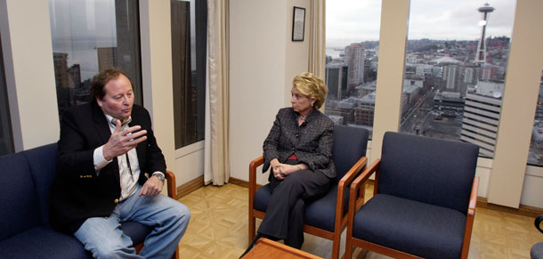 Washington Gov. Chris Gregoire, right, talks with Montana Gov. Brian Schweitzer about a controversial proposal to build a major new coal export terminal just west of Longview, Washington. (AP/Elaine Thompson)