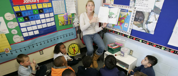 A teacher reads a book to her first-grade class at Will Rogers Elementary School in Houston. (AP/David J. Phillip)