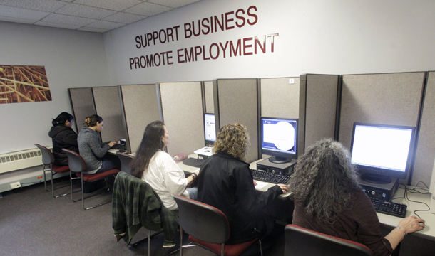 People search for jobs at WorkSource Oregon on Monday, March 21, 2011, in Salem, Oregon. The new House Republican plan to boost jobs and growth by reducing regulation and taxes would further strain the American middle class. Congress and the Obama administration need to focus on policies that will generate increased demand and sustain investment in productive endeavors. (AP/Rick Bowmer)