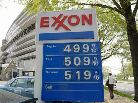 Gas prices above five dollars a gallon are seen on a sign at a gas station in Washington. (AP/Susan Walsh)