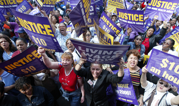 Hundreds of home health aide workers demonstrate during a rally on the first day of a three-day strike to demand fair pay and health benefits for home health aides in New York. Maids, child care workers, and home health aides lack worker protections as a result of exclusion from key federal legislation: the Fair Labor Standards Act and the Occupational Safety and Health Act. (AP/Mary Altaffer)