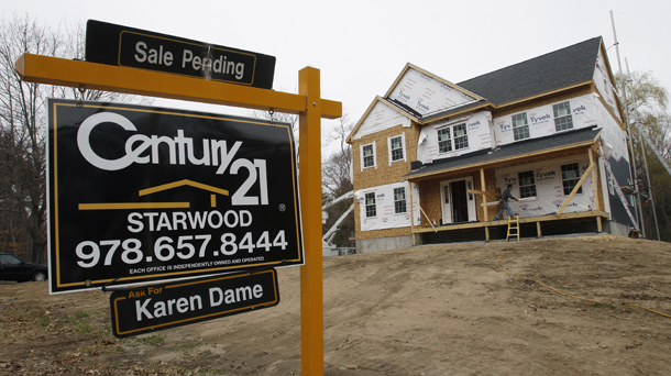 A "sale pending" sign is posted on the realty sign at a home in Wilmington, Massachusetts, April 12, 2011. (AP/Charles Krupa)