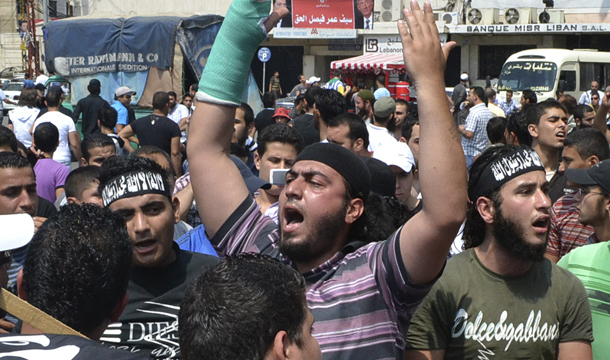 Anti-Syrian regime protesters shout slogans during a demonstration in Tripoli, northern Lebanon, Friday, June 17, 2011. As the Middle East and North Africa region continues to reshape itself, local policymakers and the  international community need to remain aware of civil society’s  important role in creating a stable democracy. Organized labor in  particular has historically played a critical role in the democratic  process. (AP Photo)