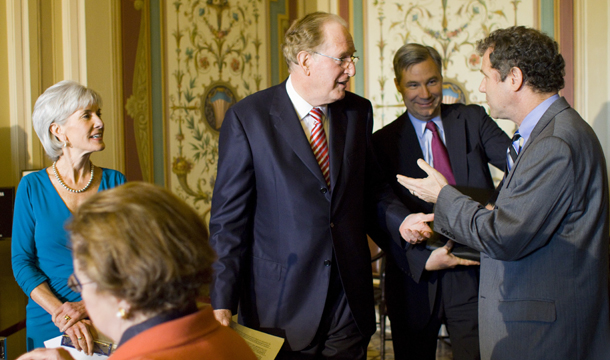 HHS Secretary Kathleen Sebelius, left, and Sen. Barbara Mikulski (D-MD), foreground, listen as Sens. Jay Rockefeller (D-WV), center, Sheldon Whitehouse (D-RI), second from right, and Sherrod Brown (D-OH), right, confer before the start of a news conference about GOP Medicare cuts on Capitol Hill in Washington. (AP/Harry Hamburg)