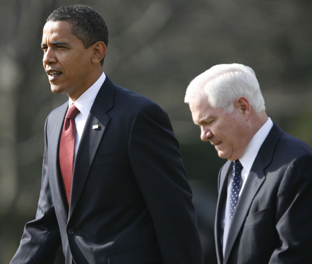 President Barack Obama, left, and Secretary of Defense Robert Gates, right, are fighting against Congress to rein in government spending on the alternate engine to the F-35 Joint Strike Fighter plane, which Gates has called an “unnecessary and extravagant expense.” (AP/Pablo Martinez Monsivais)