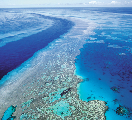 An aerial view of the Great Barrier Reef off Australia's Queensland state is seen in this September 2001 photo. The Great Barrier Reef, one of the seven natural wonders of the world, could be destroyed from ocean acidification and rising sea levels. (AP/Queensland Tourism)