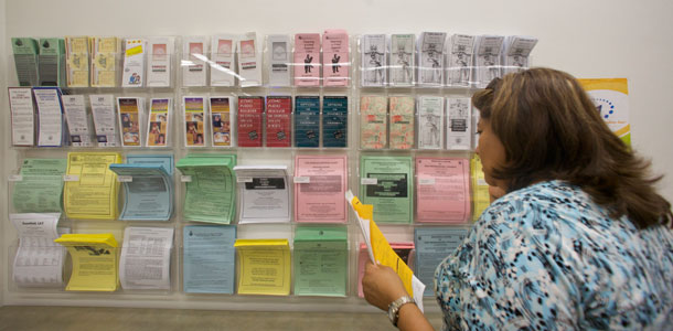 Informational pamphlets are posted at the Los Angeles County Superior Court Resource Center for Self-Represented Litigants at the Stanley Mosk Courthouse. (AP/Damian Dovarganes)