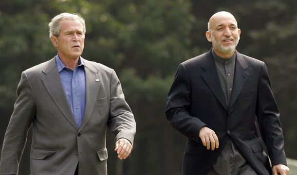 Former President George W. Bush, left, and Afghan President Hamid Karzai arrive for a joint press conference after their meetings, Monday, August 6, 2007, at Camp David, Maryland. Bush was eager to give Karzai a pass for much of his misbehavior because he viewed him as a key strategic ally, but the weakness and rot of many Afghan institutions have made it all that much harder to achieve both our development and security objectives. (AP/J. Scott Applewhite)