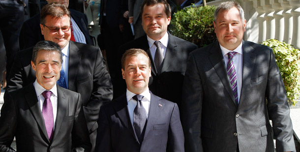 Russian President Dmitri Medvedev, center, and NATO Secretary-General Anders Fogh Rasmussen, left, stand with participants in a meeting of the Russia-NATO Council on missile defense in the Black Sea resort of Sochi, southern Russia, on July 4, 2011. Russia and the United States continue to disagree over the U.S. missile defense system in Europe.
<br /> (AP/RIA Novosti, Vladimir Rodionov, Presidential Press Service)
