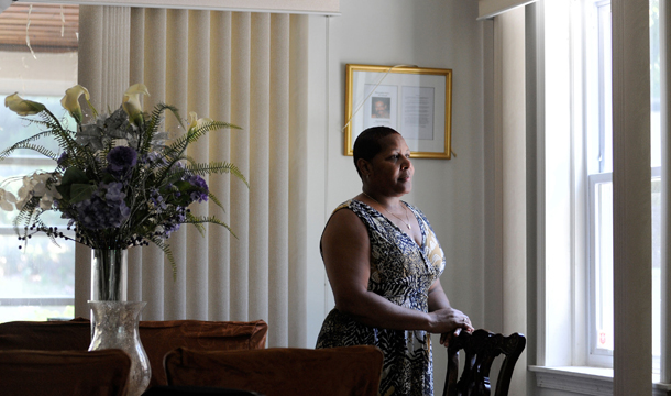 Deborah Goldring stands inside her Baltimore home on Thursday, June 30, 2011. Goldring pulled herself out of poverty and earned a middle-class life—until the Great Recession, when she lost her executive assistant job of 17 years. (AP/Steve Ruark)