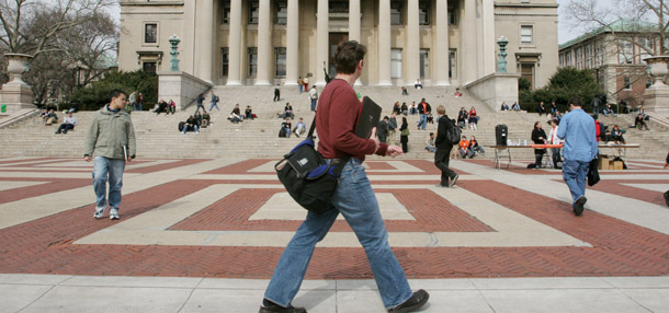 Students walk across the campus at Columbia University. Columbia is one of the more expensive four-year schools in terms of tuition, but the actual price students pay is far less. To help consumers make better decisions, policymakers and college  officials must devise ways to make the net price of college more  apparent to students and families. (AP/Tina Fineberg)