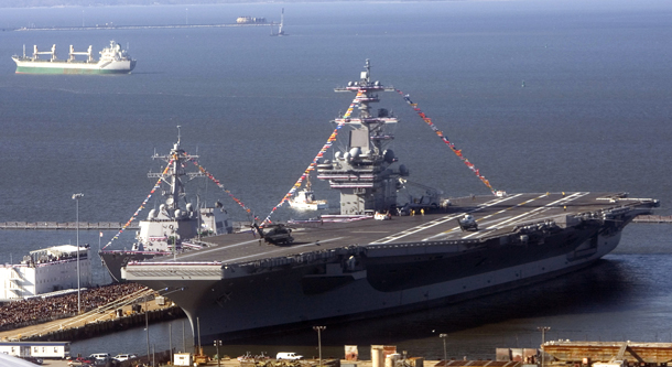 An aerial view of the USS George H.W. Bush (CVN-77) aircraft carrier in Norfolk, Virginia. The United States currently fields 11 aircraft carriers, while no other country has even one of comparable size and power. The Pentagon could cancel procurement of the CVN-80 aircraft carrier and retire two existing carrier battle groups and associated air wings, saving $7.74 billion. (AP/Haraz N. Ghanbari)