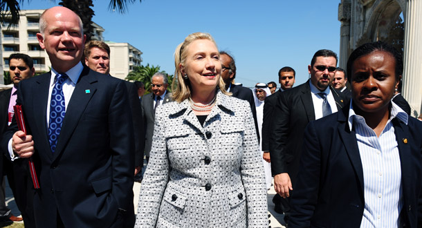 Secretary of State Hillary Rodham Clinton, center, and her counterpart United Kingdom's Foreign Secretary William Hague, left, arrive for a meeting in Istanbul, Turkey, to discuss plans for a post-Qaddafi Libya on July 15, 2011. Negotiations for a settlement between Moammar Qaddafi and the opposition forces are once again developing. (AP/Burhan Ozbilici)