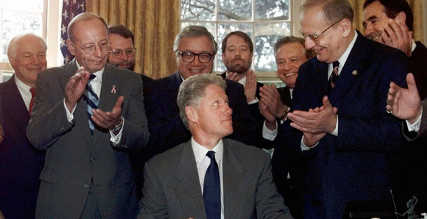 President Bill Clinton signs the Workforce Investment Act into law in 1998. The law was originally supposed to be reauthorized every five years but that's not how things have worked out. Reauthorizing it every year prevents a more stable foundation for long-term planning. (AP/Greg Gibson)