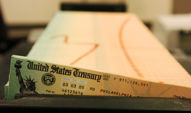 This February 2005 file photo shows trays of printed Social Security checks waiting to be mailed from the U.S. Treasury. Conservatives are promising that their 18 percent cap won’t hit Social Security. But if they exempt Social Security benefits from cuts, then they’ll need to slash everything else, including Medicare and Medicaid, by a third. (AP/Bradly C. Bower)