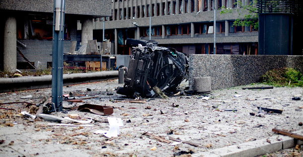 The wreckage of a car lies outside government buildings in the center of Oslo on July 22, 2011. <i>The Washington Post</i>'s Jennifer Rubin and several other conservative media outlets immediately blamed the incident on Islamic terrorists. (AP/Fartein Rudjord)