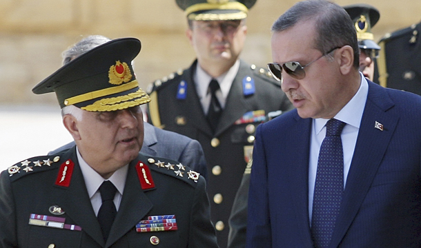 Prime Minister Recep Tayyip Erdogan, right, talks with Gen. Necdet Ozel, Turkey's new land forces commander and acting chief of staff, at the mausoleum of modern Turkey's founder Kemak Ataturk after the military's annual meeting in Ankara, Turkey, Monday, August 1, 2011. (AP)