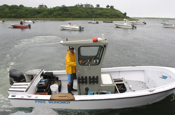 Shell fisherman Darren Saletta heads out to the flats from Barn Hill Landing in Chatham, Massachusetts. Commercial fishing jobs declined in recent years. (AP/Julia Cumes)