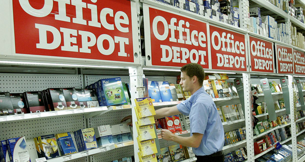 An Office Depot employee straightens shelf items at a Tallahassee, Florida store. A contest that offers prizes to the firms that generate the greatest increases in payroll over the course of the year is an inexpensive and effective way to create jobs. (AP/Phil Coale)
