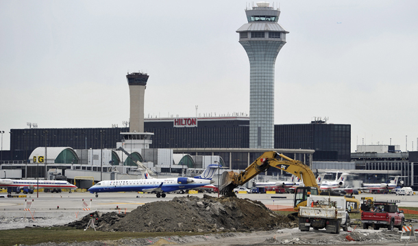 Construction crews work on building a runway as part of the O'Hare International Airport expansion plan in Chicago. (AP/Jim Prisching)