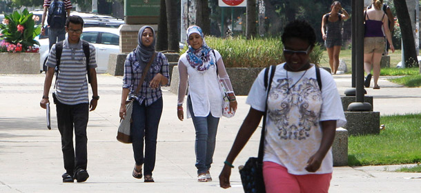 People walk on the campus at Wayne State University in Detroit on July 20, 2011. The Pell Grant program received $17 billion from the debt limit deal. (AP/Carlos Osorio)