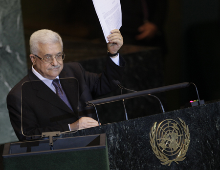 Palestinian President Mahmoud Abbas holds a letter requesting recognition of Palestine as a state as he addresses the 66th session of the U.N. General Assembly, Friday, September 23, 2011. (AP/Mary Altaffer)