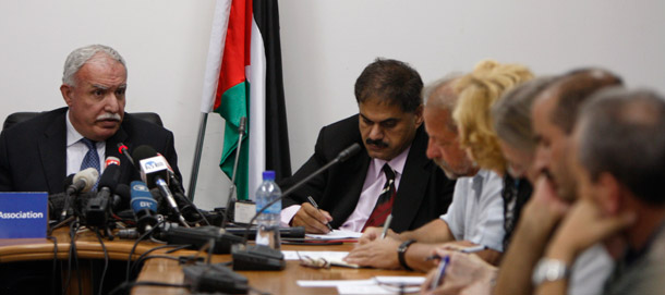 Palestinian Foreign Minister Riad al-Maliki, left, speaks during a press  conference in the West Bank city of Ramallah, September 15, 2011.  The Palestinians will ask the U.N. Security Council next week to accept them  as a full member of the United Nations. (AP/Majdi Mohammed)
