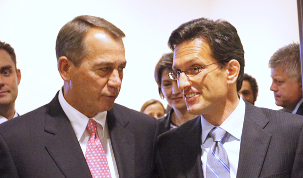 House Speaker John Boehner (R-OH), left, talks with House Majority Leader Eric Cantor (R-VA) as they leave a news conference on Capitol Hill in Washington, Monday, August 1, 2011. (AP/Jacquelyn Martin)