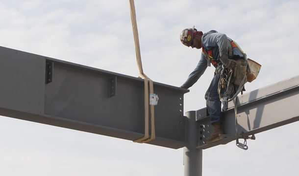 A worker guides a steel beam into place at the Love Field modernization project construction site Thursday, September 1, 2011, in Dallas. In August 2011 the unemployment rate in the construction industry stood at 13.2 percent—substantially higher than the economy-wide unemployment rate of 9.1 percent. (AP/LM Otero)