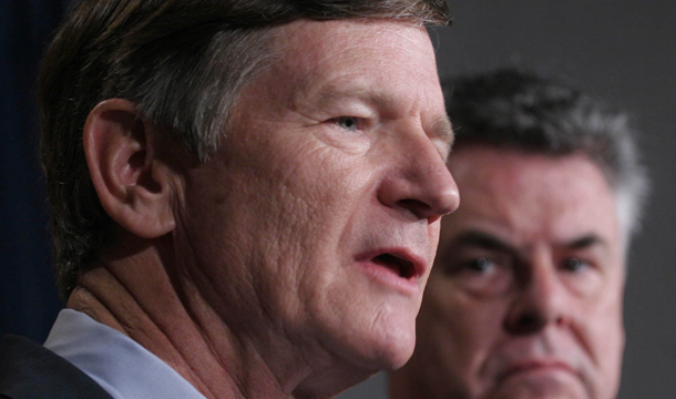 House Judiciary Committee Chairman Lamar Smith (R-TX), left, accompanied by Rep. Peter King (R-NY), right, speaks to reporters on Capitol Hill in Washington. Rep. Smith has introduced the Legal Workforce Act of 2011, H.R. 2164, to make E-Verify mandatory for all employers across the country. (AP/Lauren Victoria Burke)