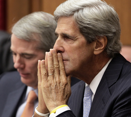 Sen. John Kerry (D-MA), right, and Sen. Rob Portman (R-OH), left, arrive for the start of the opening meeting of the Joint Select Committee on Deficit Reduction, often called the