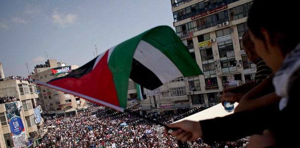 A girl waves a Palestinian flag during a rally in support of the Palestinian bid for statehood recognition in the United Nations in the West Bank city of Ramallah on September 21, 2011. (AP/Tara Todras-Whitehill)
