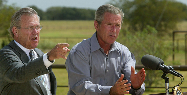 President George W. Bush and Defense Secretary Donald H. Rumsfeld speak at a press conference on military action against Iraq in Crawford, Texas, on August 21, 2002. (AP/Rick Bowmer)