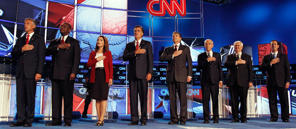 Republican presidential candidates sing the National Anthem at the debate on September 12, 2011, in Tampa, Florida. CNN co-hosted the debate with the Tea Party Express. (AP/Chris O'Meara)