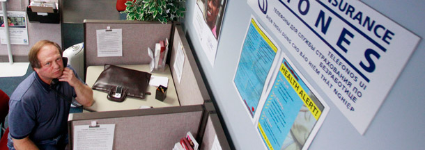 Eric Rosenkrantz waits on the unemployment insurance phone at WorkSource Oregon on September 2, 2011. Unemployment benefits have played a key role in  helping unemployed workers pay their bills while they search for a new  job. (AP/Rick Bowmer)