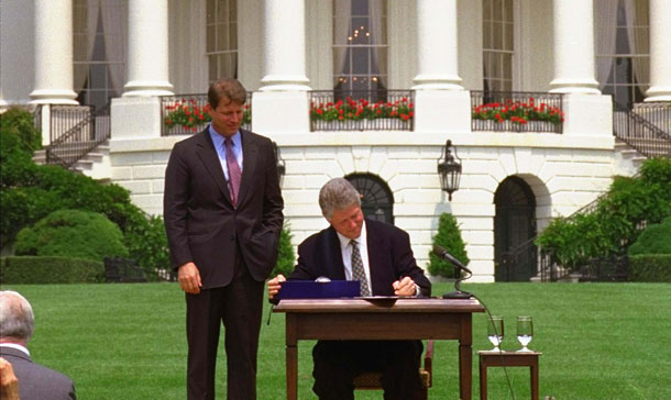 Vice President Gore looks on as President Clinton signs the Budget Reconciliation Act of 1993 bill on the South Lawn of the White House Tuesday, August 10, 1993. (AP/Barry Thumma)