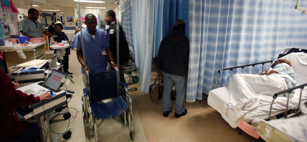 A hospital employee pushes a wheelchair at the emergency room at Jamaica Hospital in New York. Many of the prices Medicare pays for goods such as wheelchairs are exorbitant. (AP/Seth Wenig)