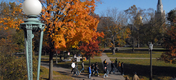 Students walk across the campus of the University of Notre Dame. Large Catholic universities such as Notre Dame employ people of  many different religions—as well as those with no religion—yet do not  want their health care plans to cover contraception. (Flickr/<a href=