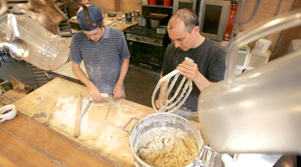 Workers make biscotti dough at the Enrico Biscotti Co. in Pittsburgh, Pennsylvania. Many small-business owners offer equal health insurance benefits to gay employees and their families, including same-sex domestic partners, spouses, and legally adopted children. (AP/Keith Srakocic)