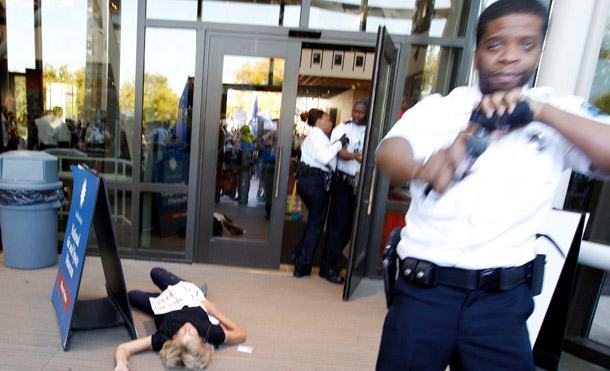 A demonstrator lies on the ground in front of the National Air and Space Museum in Washington on October 8, 2011. A right-wing magazine editor infiltrated the group of protesters at the museum. (AP/Luis Magana)