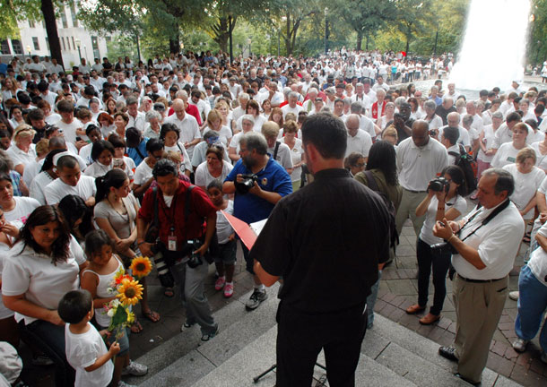Participants bow their heads in prayer during a demonstration  in Birmingham, Alabama on June 25, 2011 to protest Alabama's new law against illegal immigration. Now that Alabama has passed what's widely considered the nation's most restrictive state law against illegal immigration, mainstream churches, faith-based organizations and individual members are leading opposition to the act. (AP/Jay Reeves)