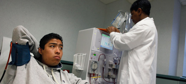 An immigrant receives dialysis treatment at a clinic in New York. Undocumented and documented immigrants in Alabama will be less likely to seek health treatment under the new law, putting citizens at risk and driving up costs. (AP/Seth Wenig)