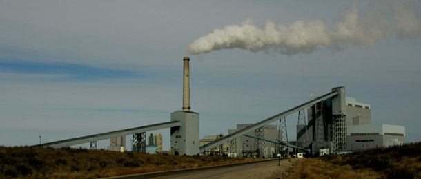 A coal-fired power plant rises beyond a pile of coal as it churns out electricity in Holcomb, Kansas. Some utilities and coal companies are up in arms over forthcoming EPA pollution rules. (Ap/Charlie Riedel)