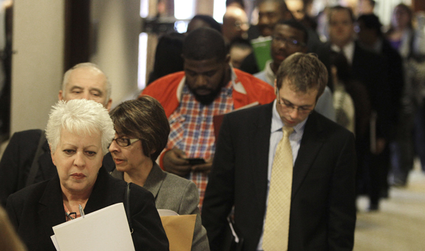 Job seekers stand in line and wait to enter a career fair in Independence, Ohio, Thursday, November 10, 2011. (AP/Tony Dejak)