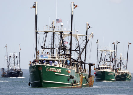 Fishing vessels form a flotilla in Vineyard Haven Harbor, in Vineyard Haven, Massachusetts. (AP/Steven Senne)