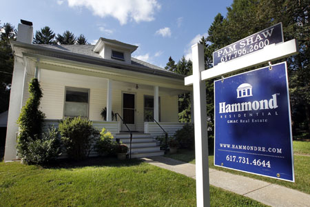 A home has a real estate sign in front in Newton, Massachusetts. (AP/Steven Senne)
